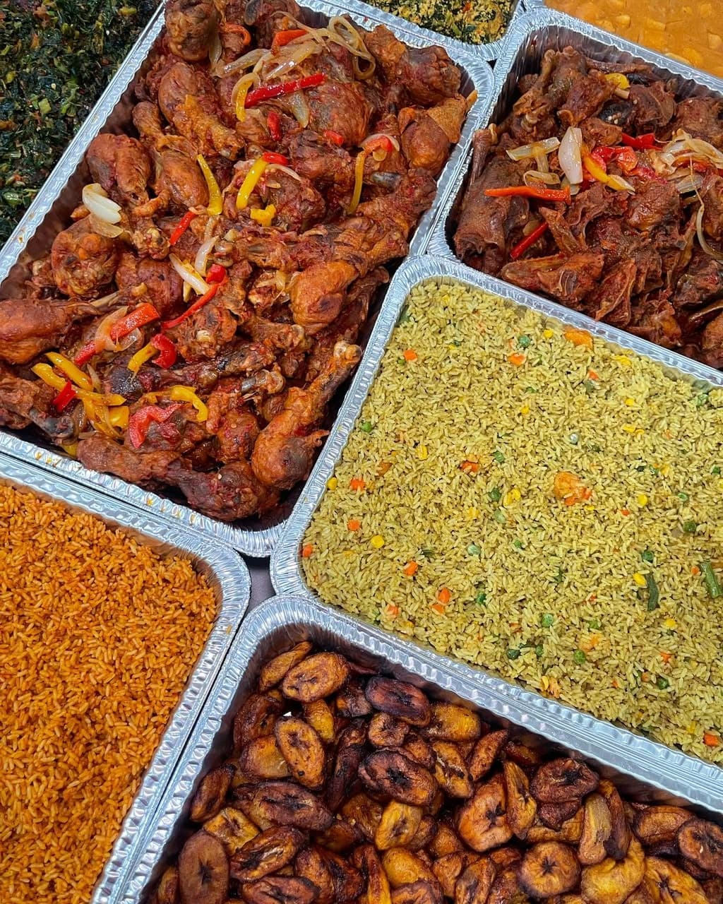 Peppered chicken and goat meat served in catering trays
